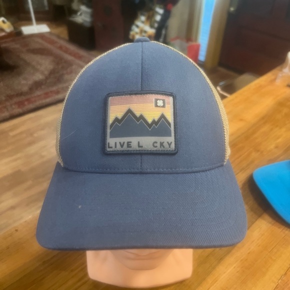 black clover Other - Blue “Live Lucky” Trucker Hat with Mountain Patch